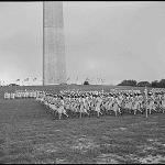Units of WAVES march in formation during a rally at the Washington Monument in celebration of the second anniversary of the establishment of the corps. Washington, D.C. 31 July 1944
