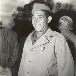 Cpl. Marcilio Juiz Pinto of Sao Paolo smiles with his Silver Star which he just received from Lt. Gen. Mark Clark. He is the first Brazilian enlisted man to receve a US decoration for bravery. 16 November 1944. Gift in Memory of William F. Caddell Sr., 2007.048