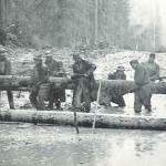 Building a box culvert in knee-deep mud and water. The platoons flipped coins for jobs like this, and these boys lost.