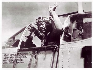 Photograph of Tuskegee Airman Captain Andrew D. Turner in his P-51 C fighter aircraft