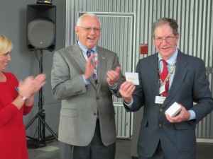 Roland "Tiger" Hymel receives his gold Four-Star pin from Dr. Mueller