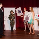 Cole Conrad, Ben Ellender, Brayli Wix, Jill Elliot, and Will George act out a scene from their performance on the Vietnam War era.