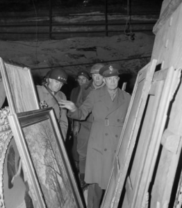 Eisenhower looking at rescued paintings--painted in linseed oil on flax canvases