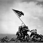 Flag-raising on Mount Suribachi, Iwo Jima on February 23, 1945. Courtesy of The National Archives and Records Administration.