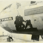 Joe Rosenthal's photograph of the flag-raising on Iwo Jima became famous quickly, as shown by the nose art on this B-29 Superfortress on the island of Tinian in 1945. Gift of David Lawrence, from the collection of The National WWII Museum. 2012.195.156.