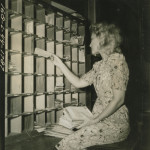 Margaret D. Bailey sorting mail at the Army Post Office, Fort Benning, Georgia on 12 July 1944