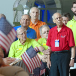 Calvin Moret standing the presentation of colors with the Mardi Gras Chorus at the Museum's End of WWII Ceremony on August 15, 2015.