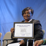 Margaret Pender holding the brick certificate for her relative, Medal of Honor recipient Willy James. All seven African Americans who received the Medal of Honor for their service in World War II will have a brick placed at the Museum in their honor.